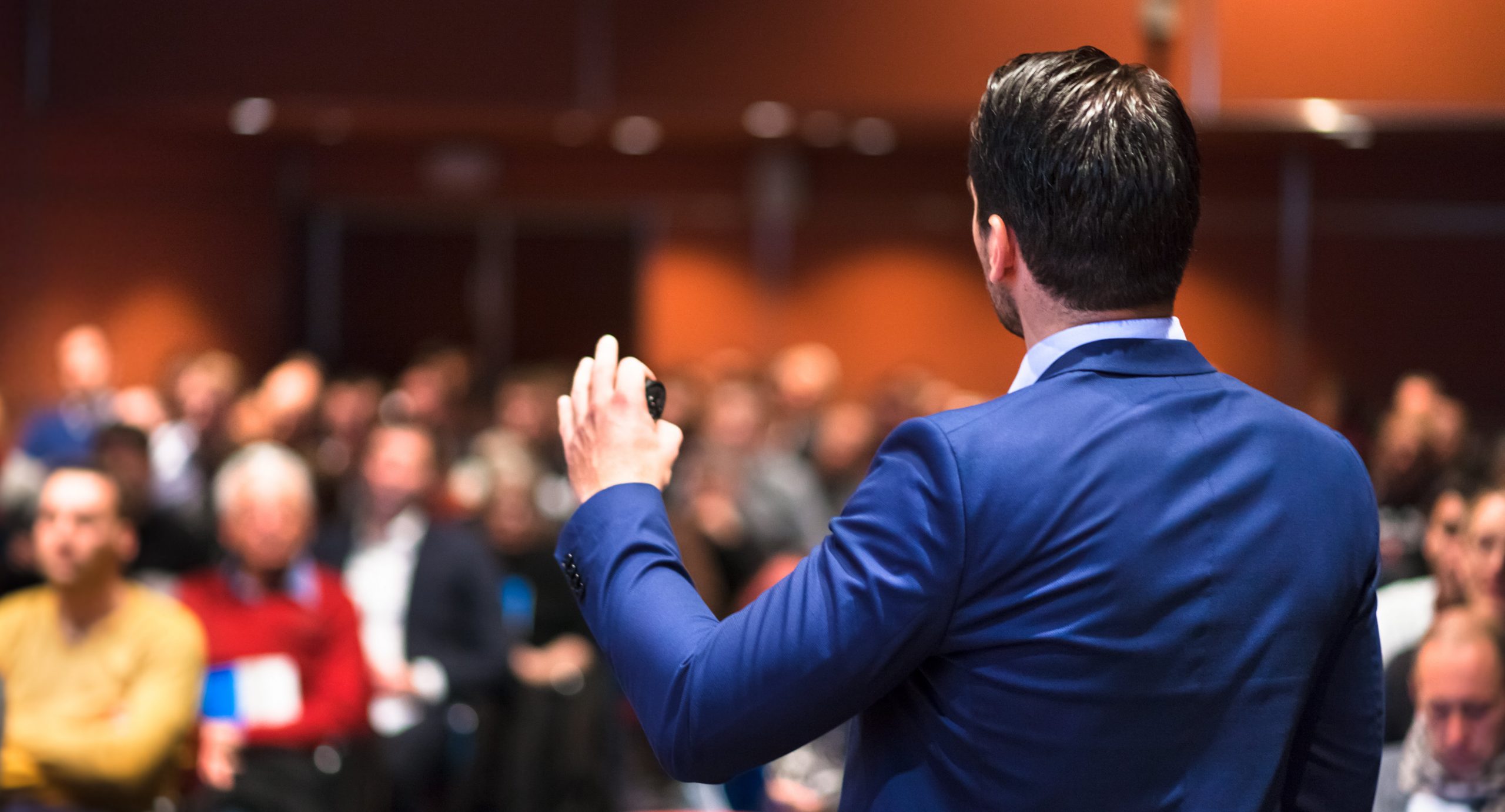 Public speaker giving talk at Business Event. Public speaker giving talk at Business Event.